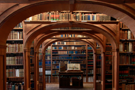 an indoor archway with lots of books around it