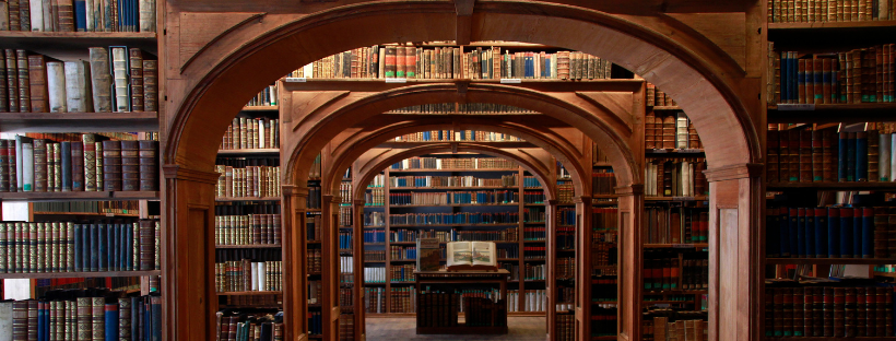 an indoor archway with lots of books around it